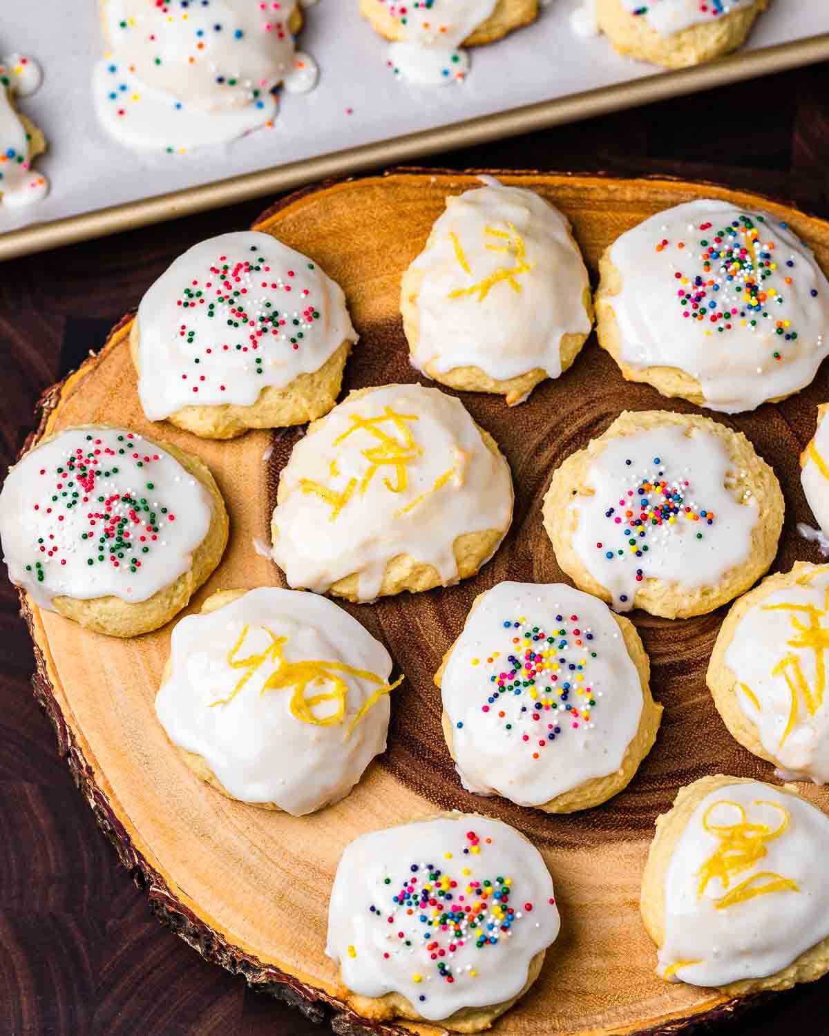 Wood board with assortment of lemon ricotta cookies.