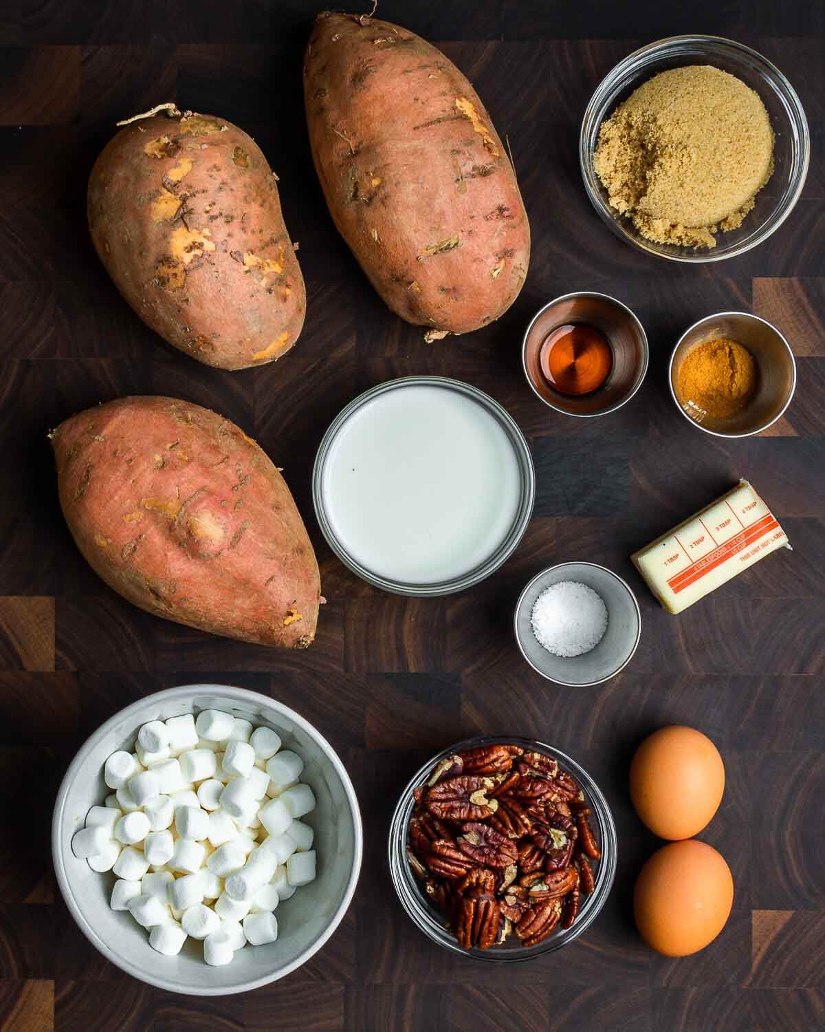 Ingredients shown: sweet potatoes, brown sugar, vanilla, cinnamon, milk, salt, butter, marshmallows, pecans, and eggs.
