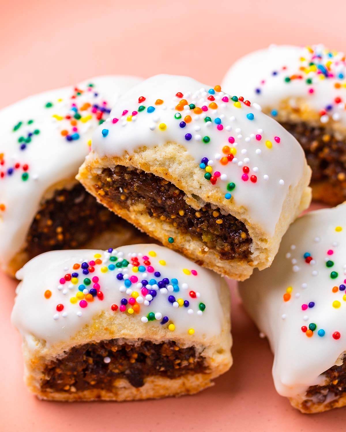 Cuccidati cookies in pink plate.