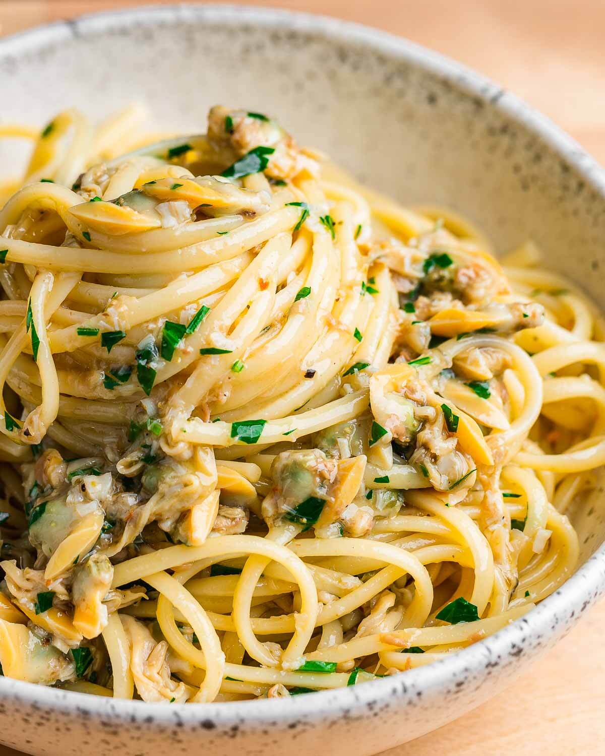 White bowl with canned linguine with white clam sauce.