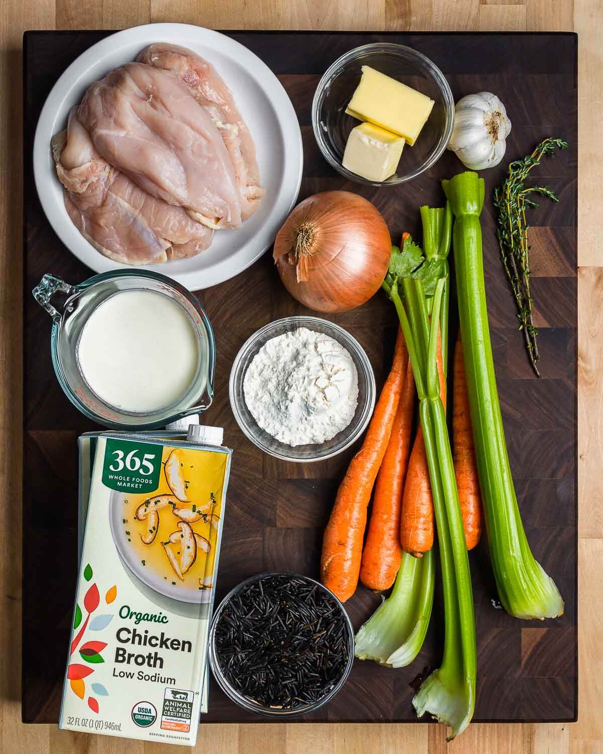 Ingredients shown: chicken, butter, garlic, onion, celery, carrots, thyme, heavy cream, low-sodium chicken stock, flour, and wild rice.