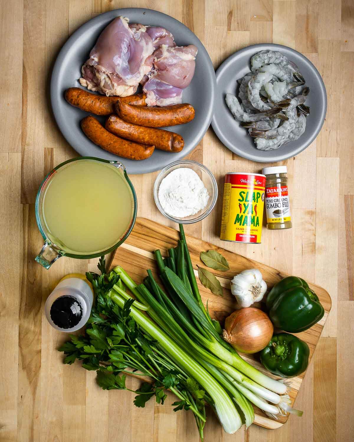 Ingredients shown: Andouille, chicken, shrimp, chicken stock, flour, Cajun spice, filé powder, pepper, onion, garlic, green onions, celery, and parsley.