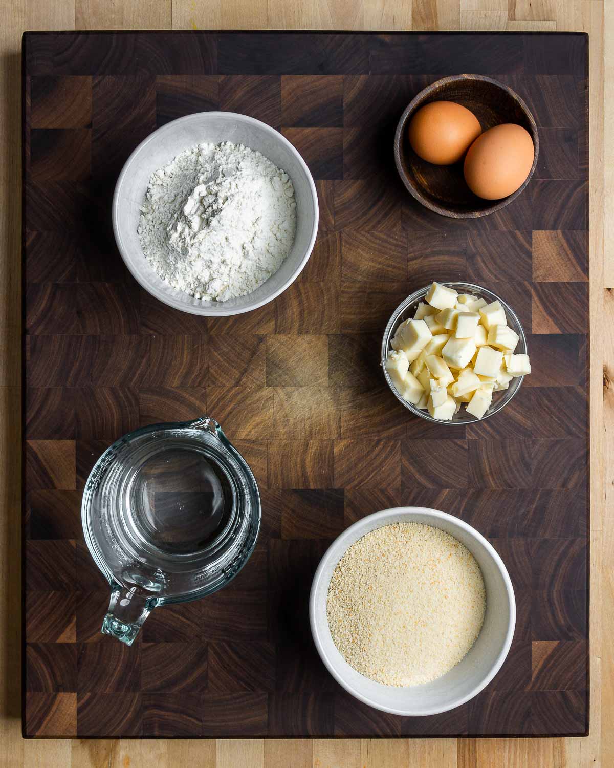 Ingredients shown: flour, eggs, water, caciocavallo cheese, and breadcrumbs.