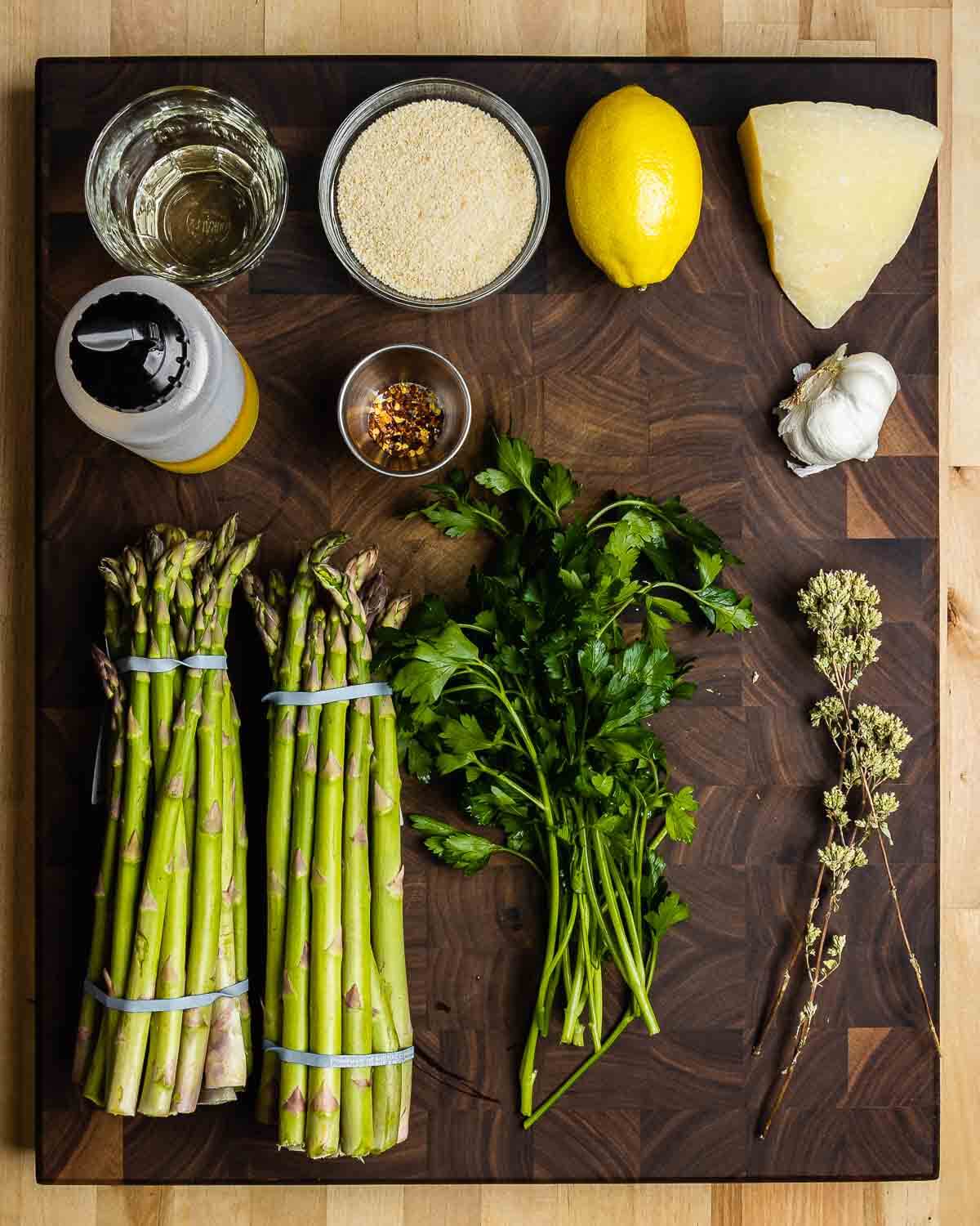 Ingredients shown: white wine, breadcrumbs, lemon, Pecorino, olive oil, hot red pepper flakes, garlic, asparagus, parsley, and Sicilian oregano.