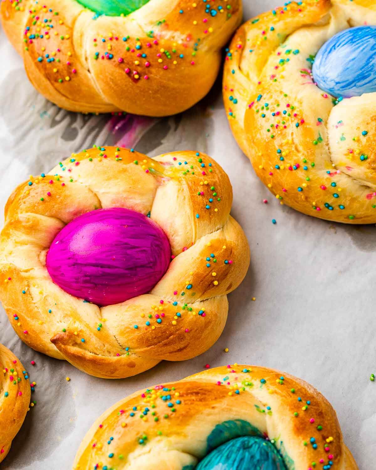 Closeup shot of Easter bread with colored eggs.
