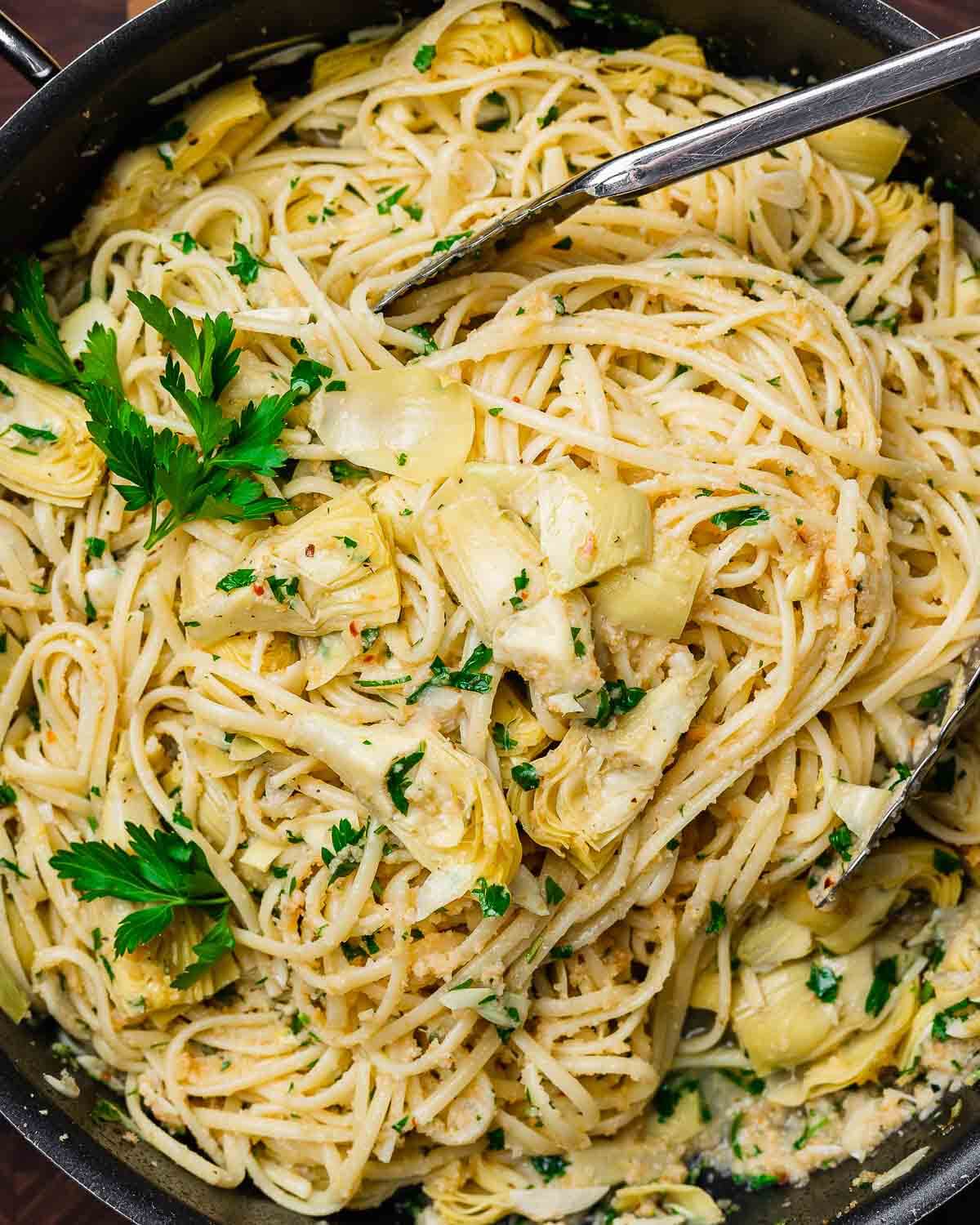 Overhead shot of pasta with artichoke hearts and breadcrumbs.