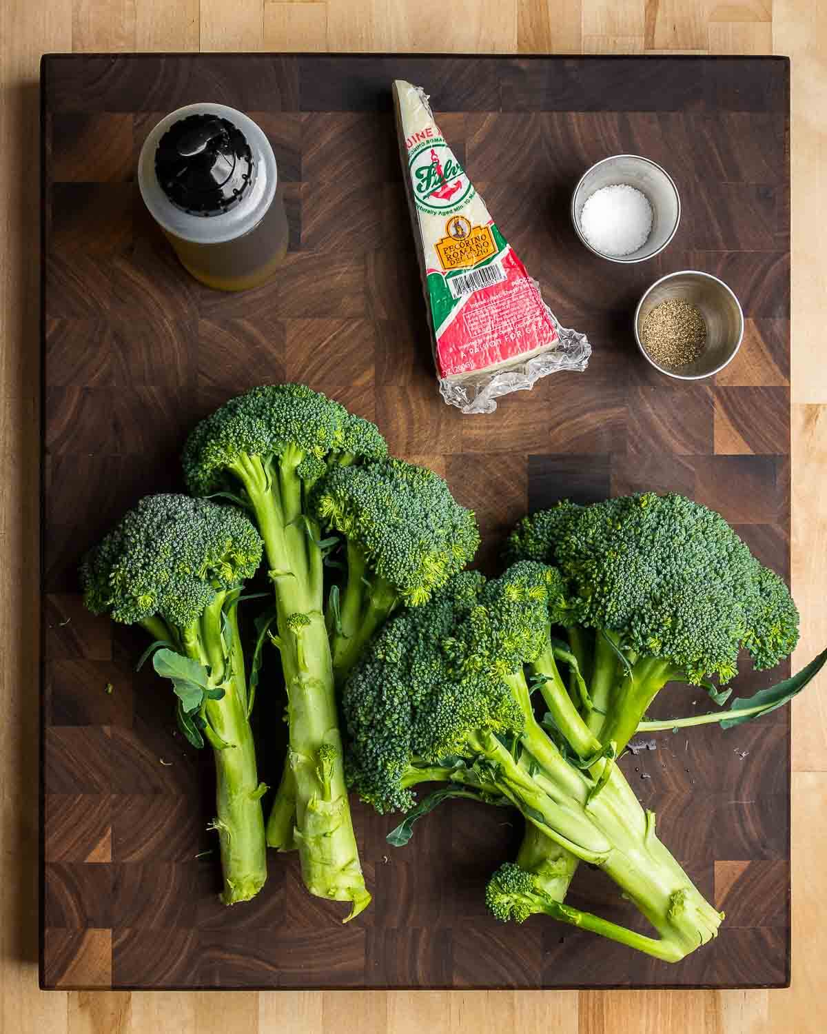 Ingredients shown: extra virgin olive oil, Pecorino Romano, salt, pepper, and broccoli