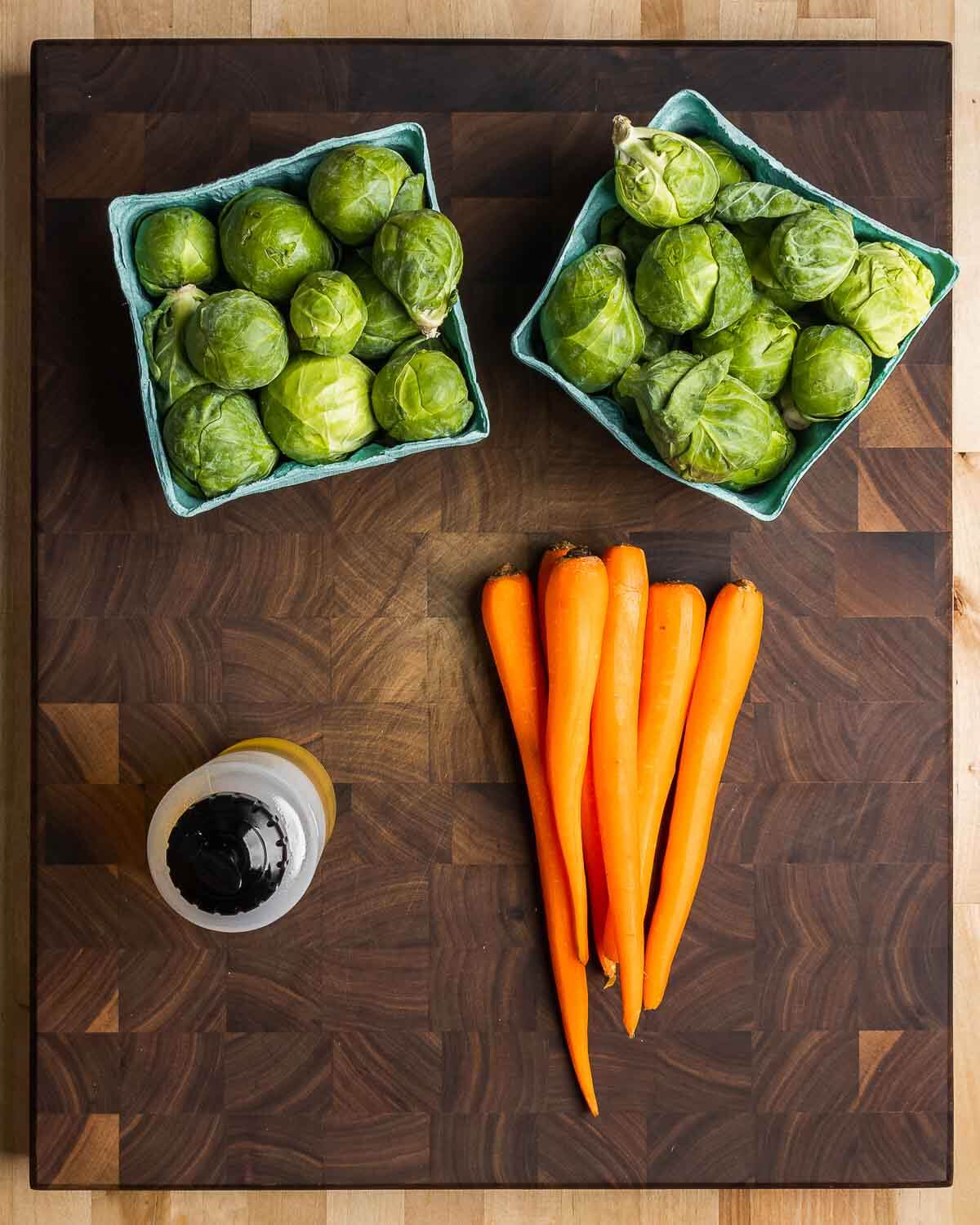 Ingredients shown: brussels sprouts, carrots, and olive oil.