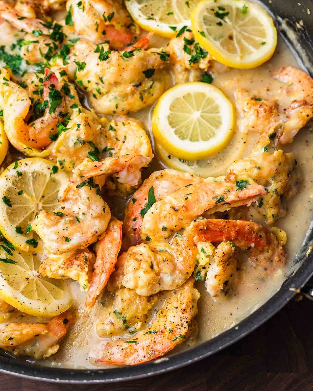 Closeup shot of black pan with shrimp francese.