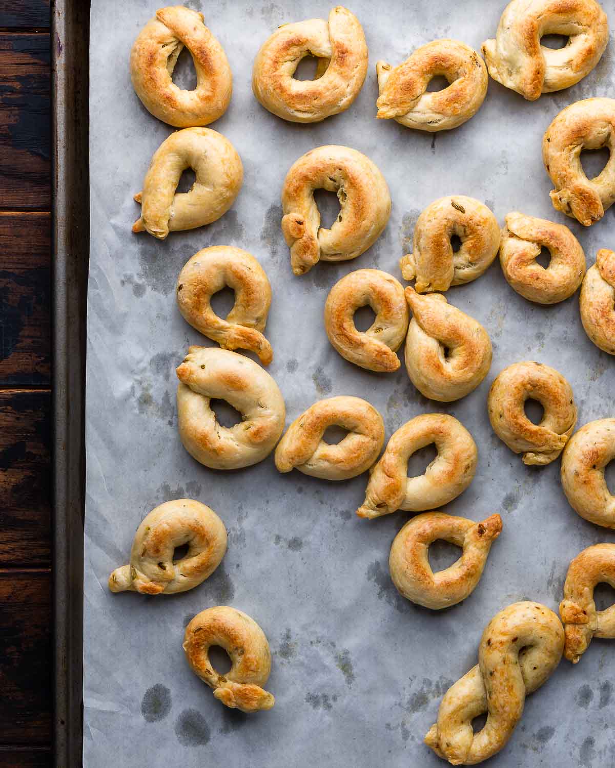 Overhead shot of baking sheet with cooked taralli.