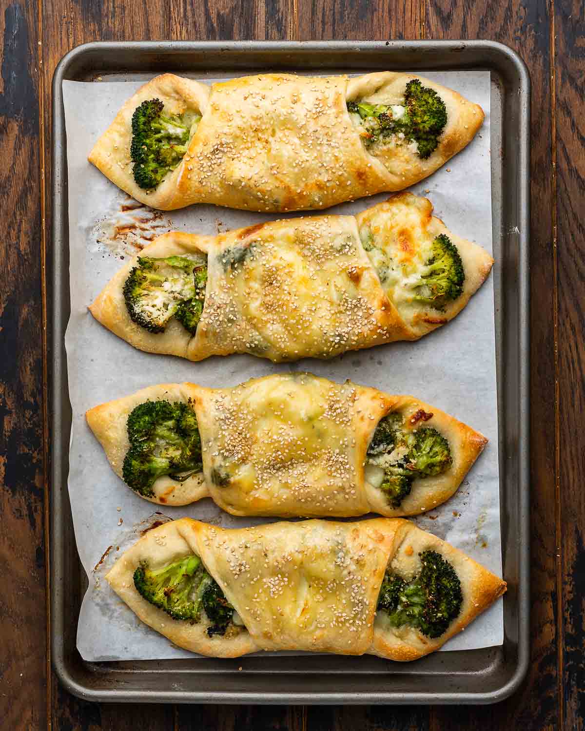 Overhead shot of Italian broccoli rolls in sheet pan.