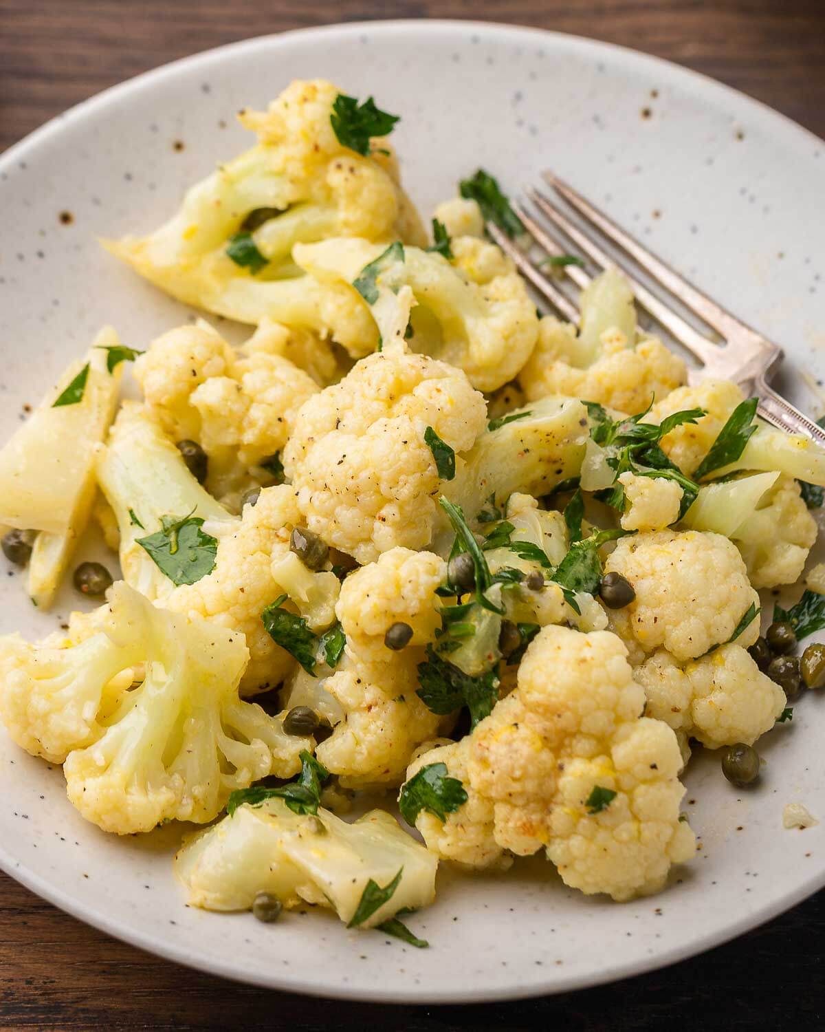 Closeup shot Italian cauliflower salad in white plate.