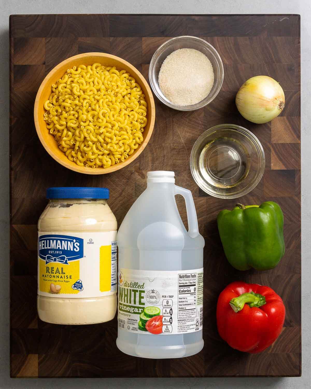 Ingredients shown: macaroni, sugar, onion, vegetable oil, mayonnaise, vinegar, bell pepper.