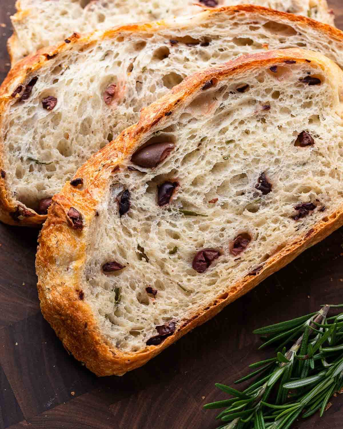 Closeup shot of slice of olive bread.