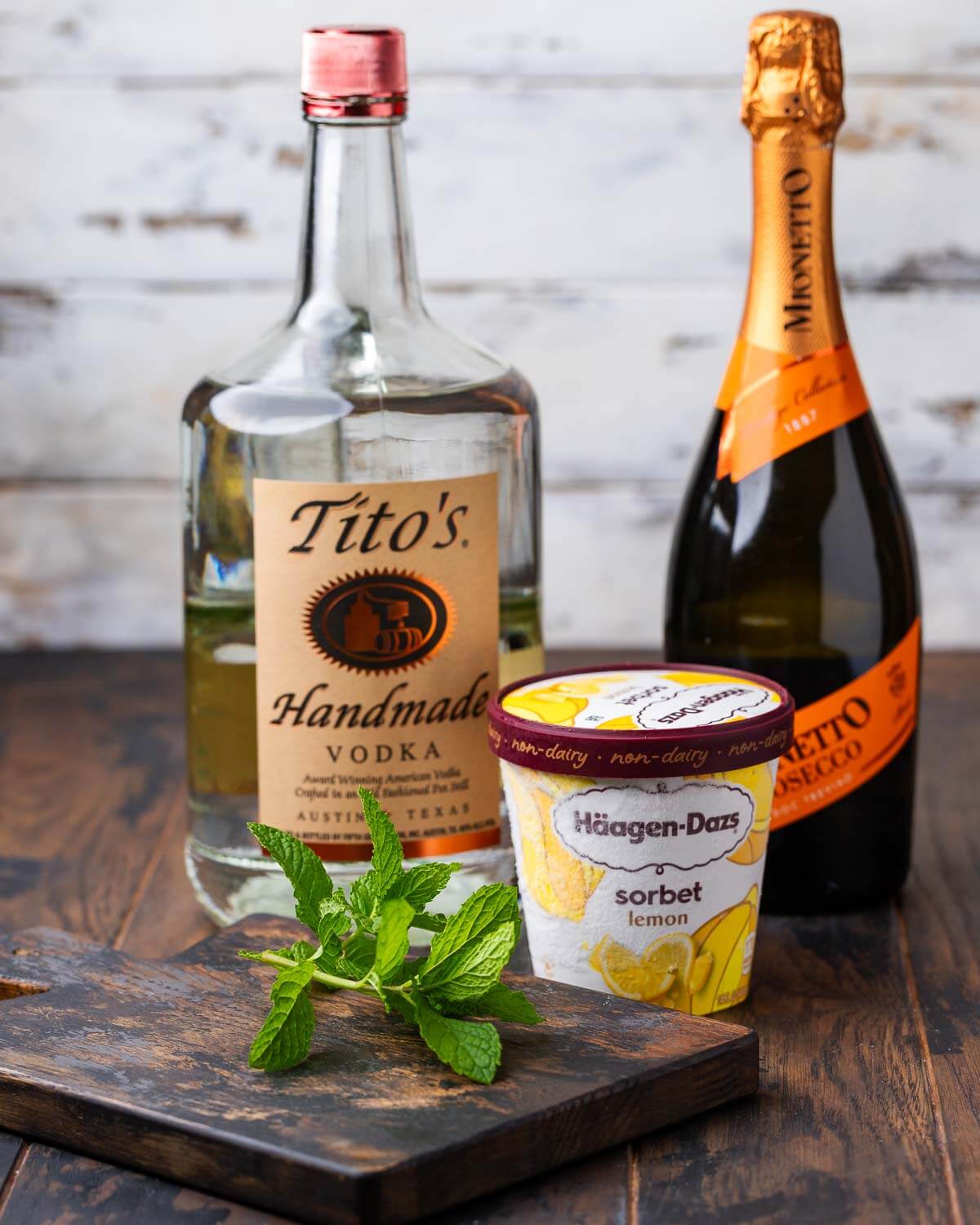 Ingredients shown: vodka, prosecco, lemon sorbet, and mint.