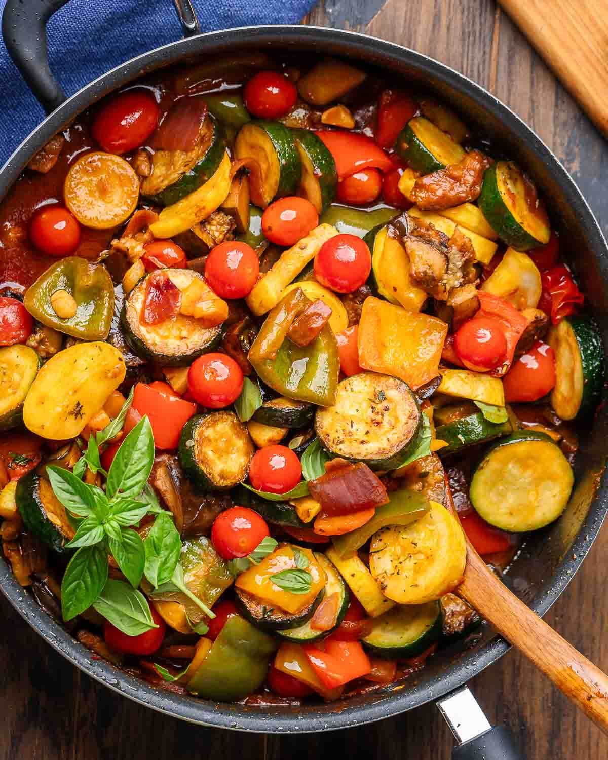 Overhead shot of ratatouille in black pan.