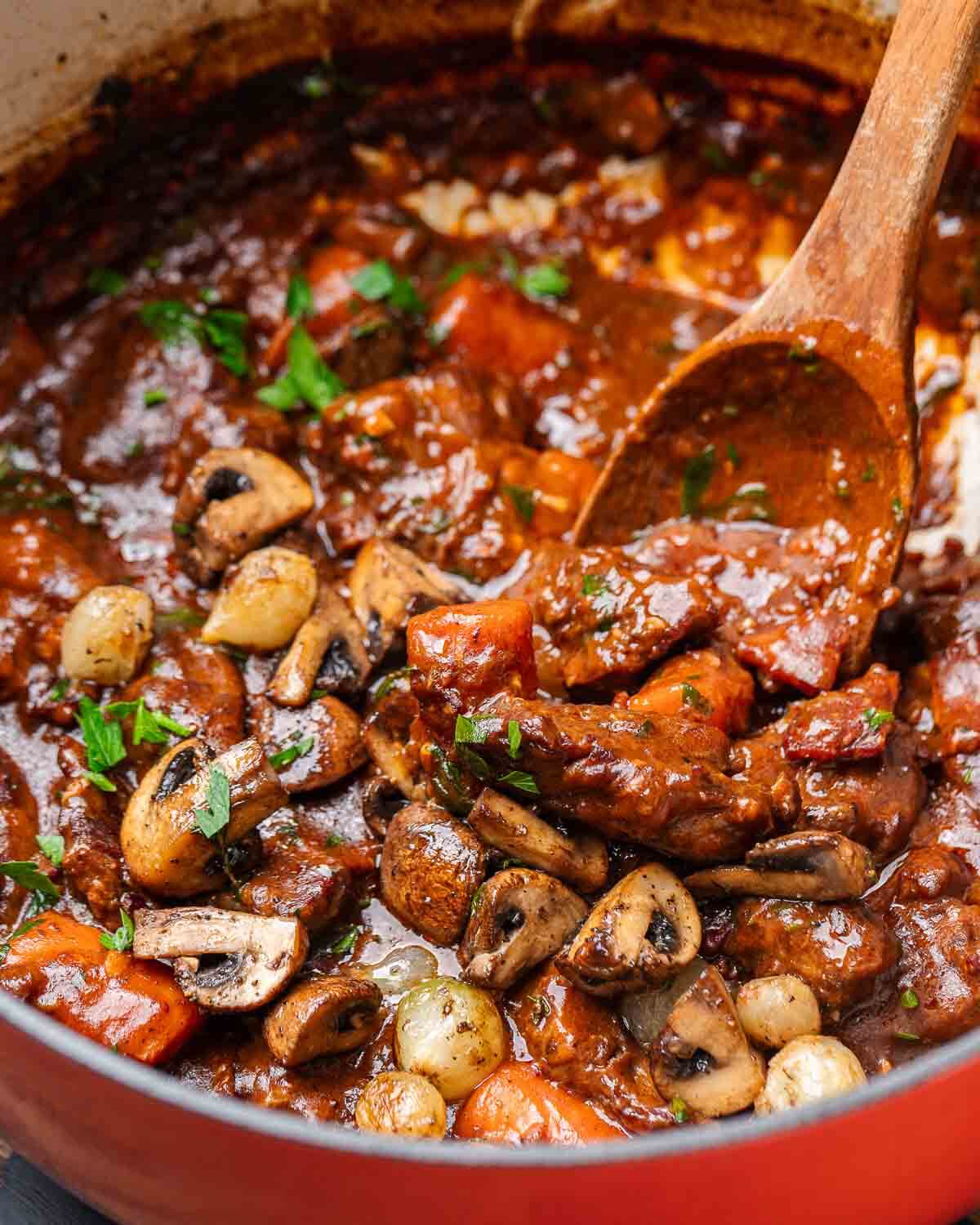 Closeup shot of Beef Bourguignon in Dutch oven pot.