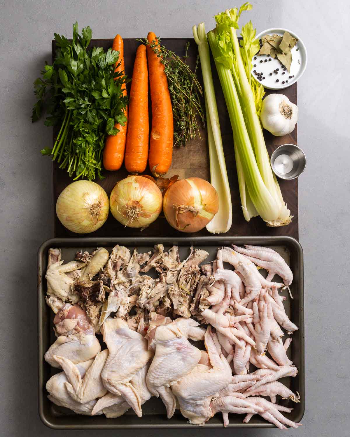 Ingredients shown: parlsey, carrots, thyme, celery, peppercorns, bay leaves, garlic, vinegar, onions, chicken wings, chicken feet, and chicken backbones.