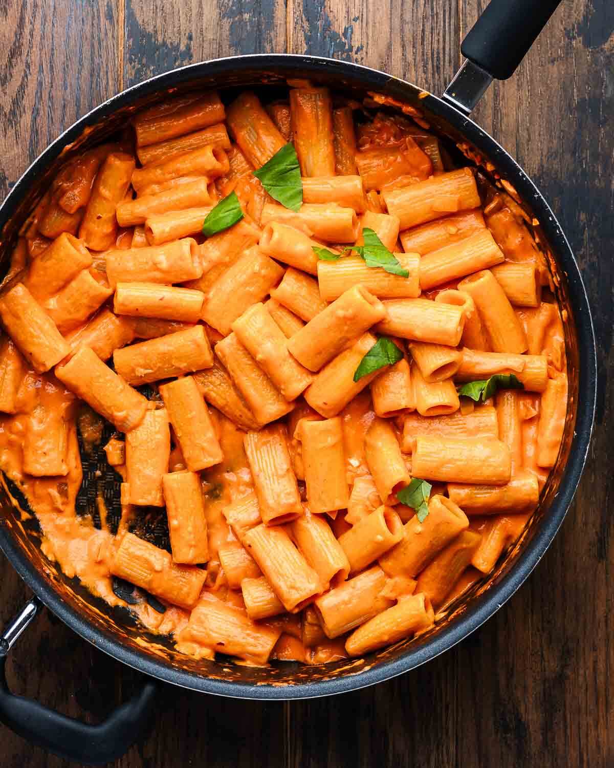 Overhead shot of large black pan with rigatoni alla vodka.