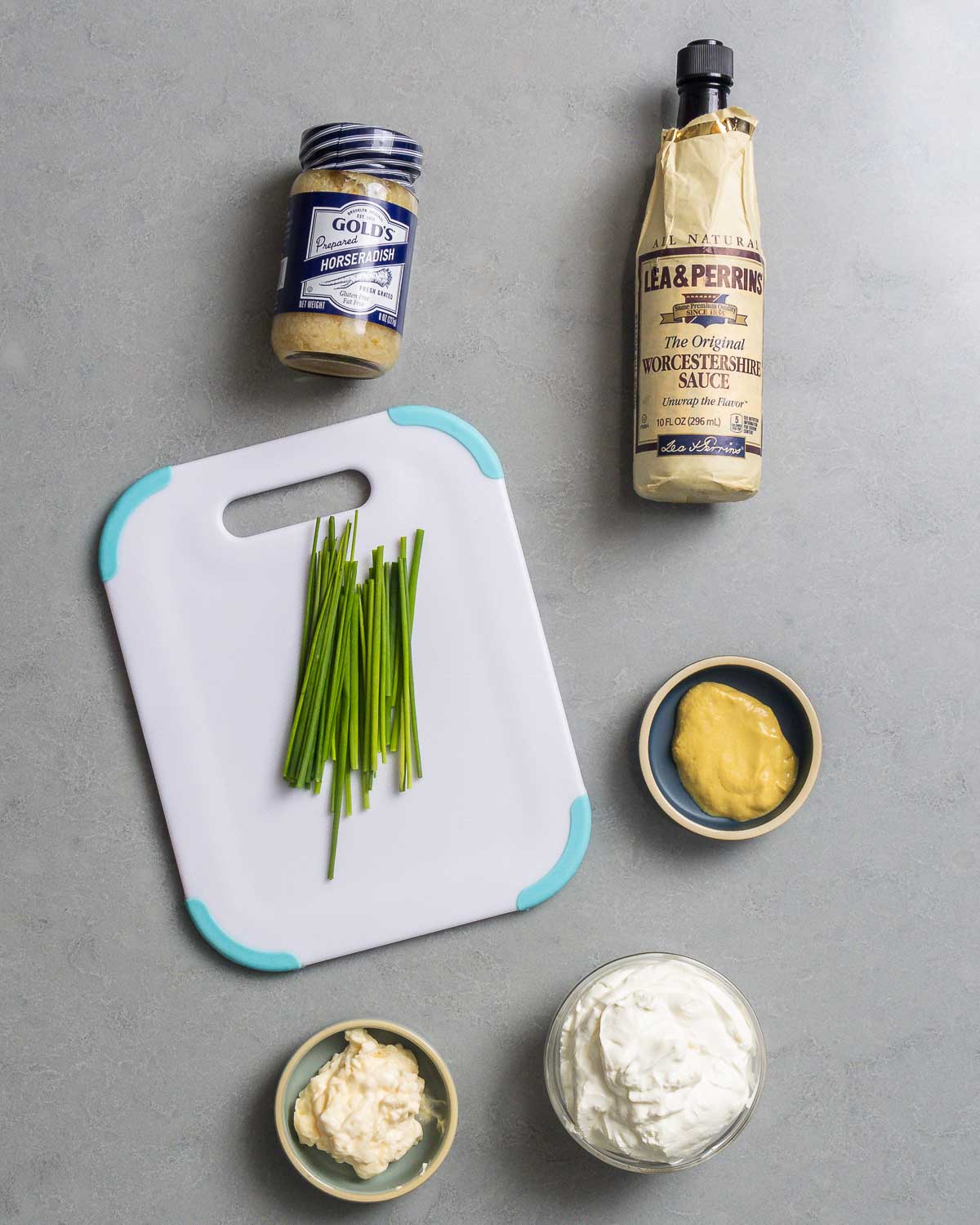 Ingredients shown: horseradish, Worcestershire sauce, chives, mustard, mayonnaise, and sour cream.