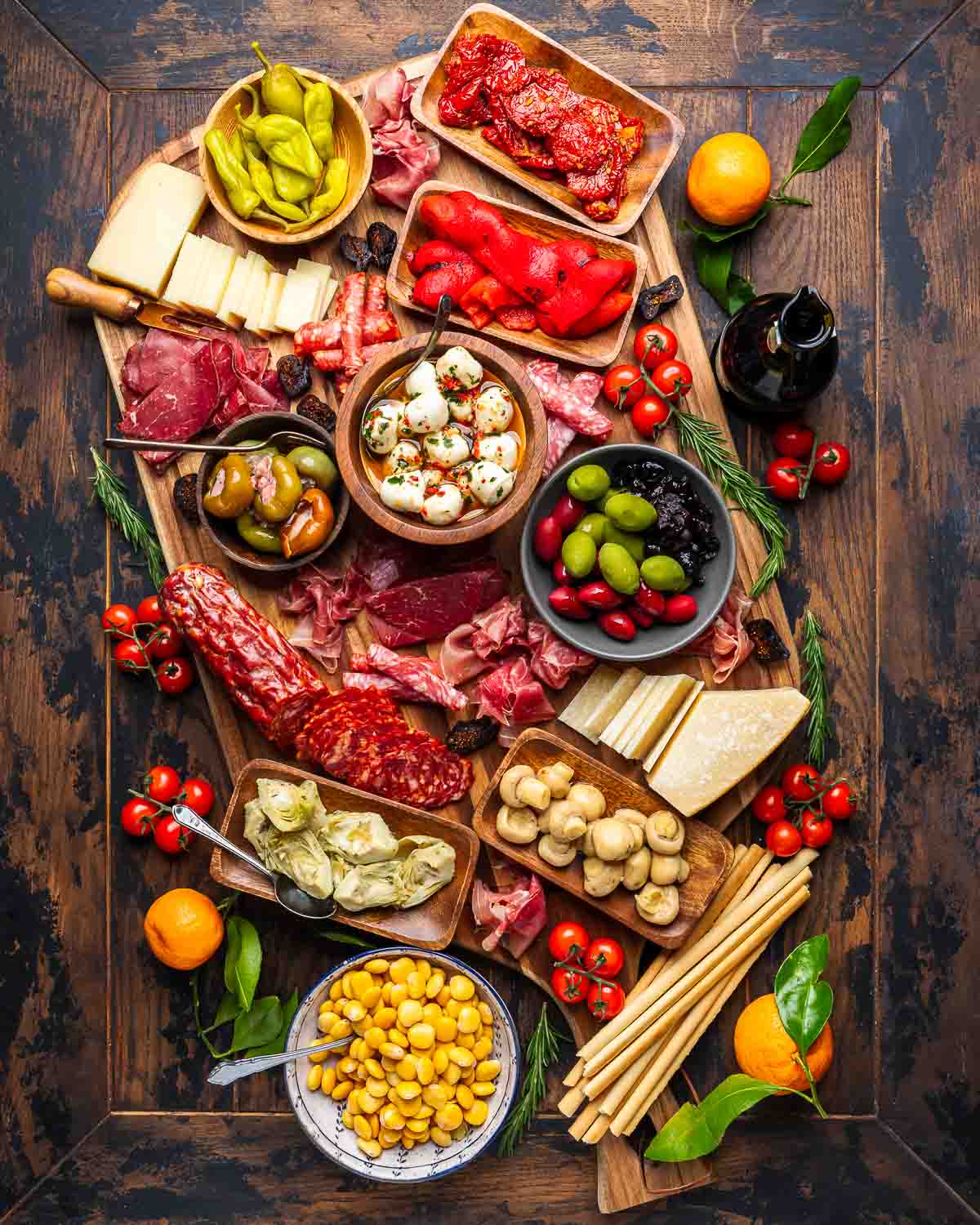 Large antipasto platter with meats, cheeses, olives, and pickled vegetables.