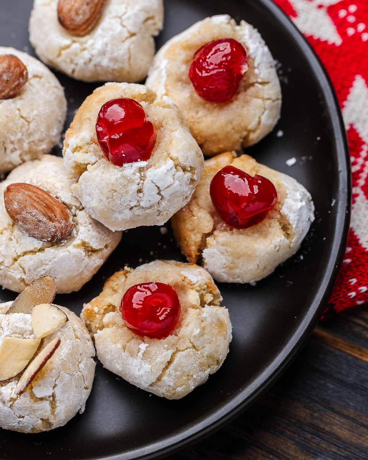 Black plate with Italian almond cookies.