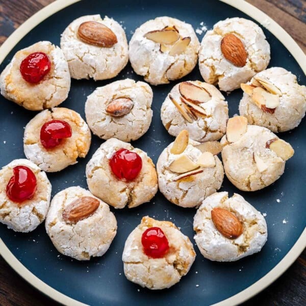Italian almond cookies in blue plate featured image.