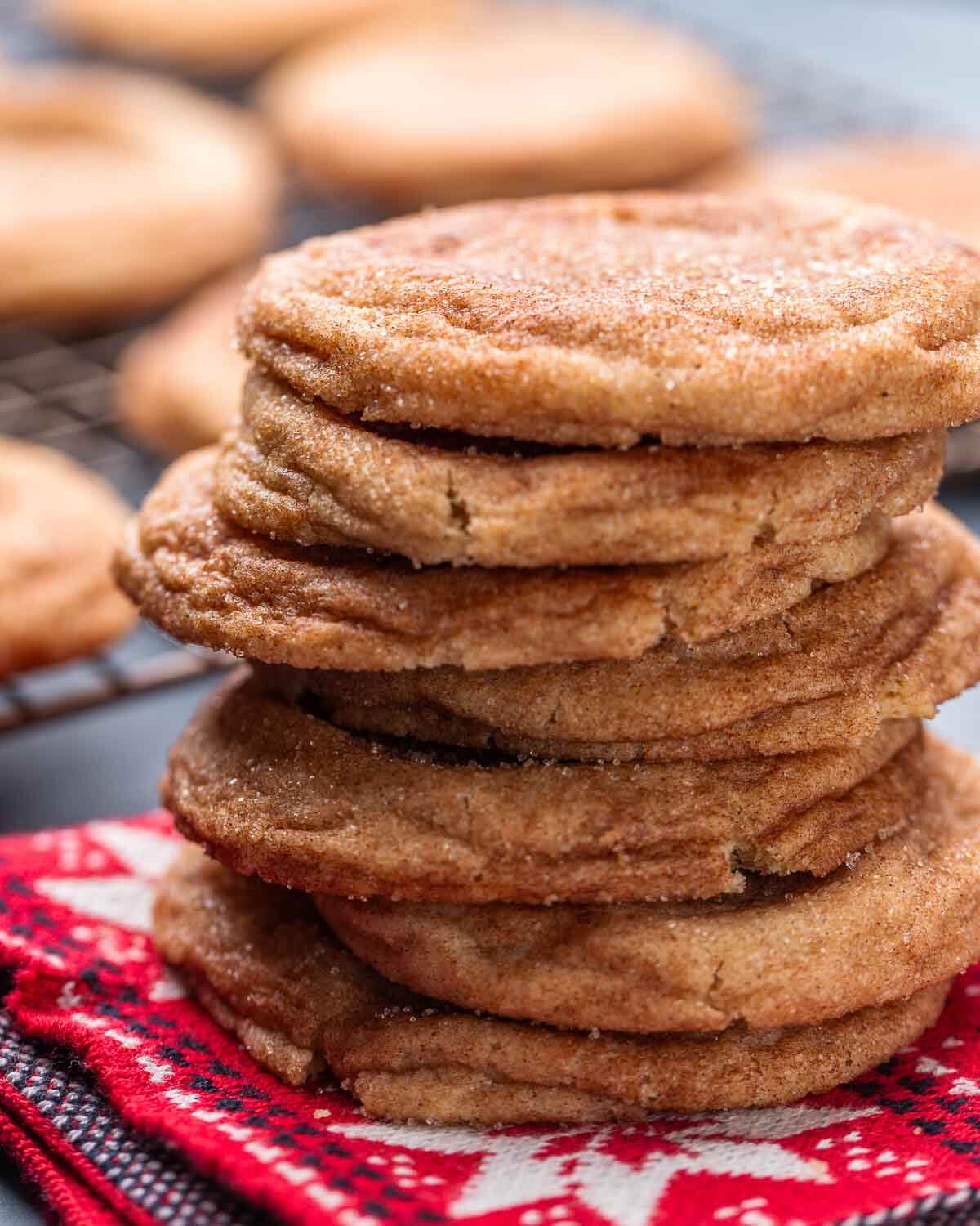 Stack of snickerdoodles on red napkin.