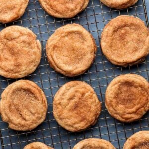 Snickerdoodle cookies on wire rack for featured image.