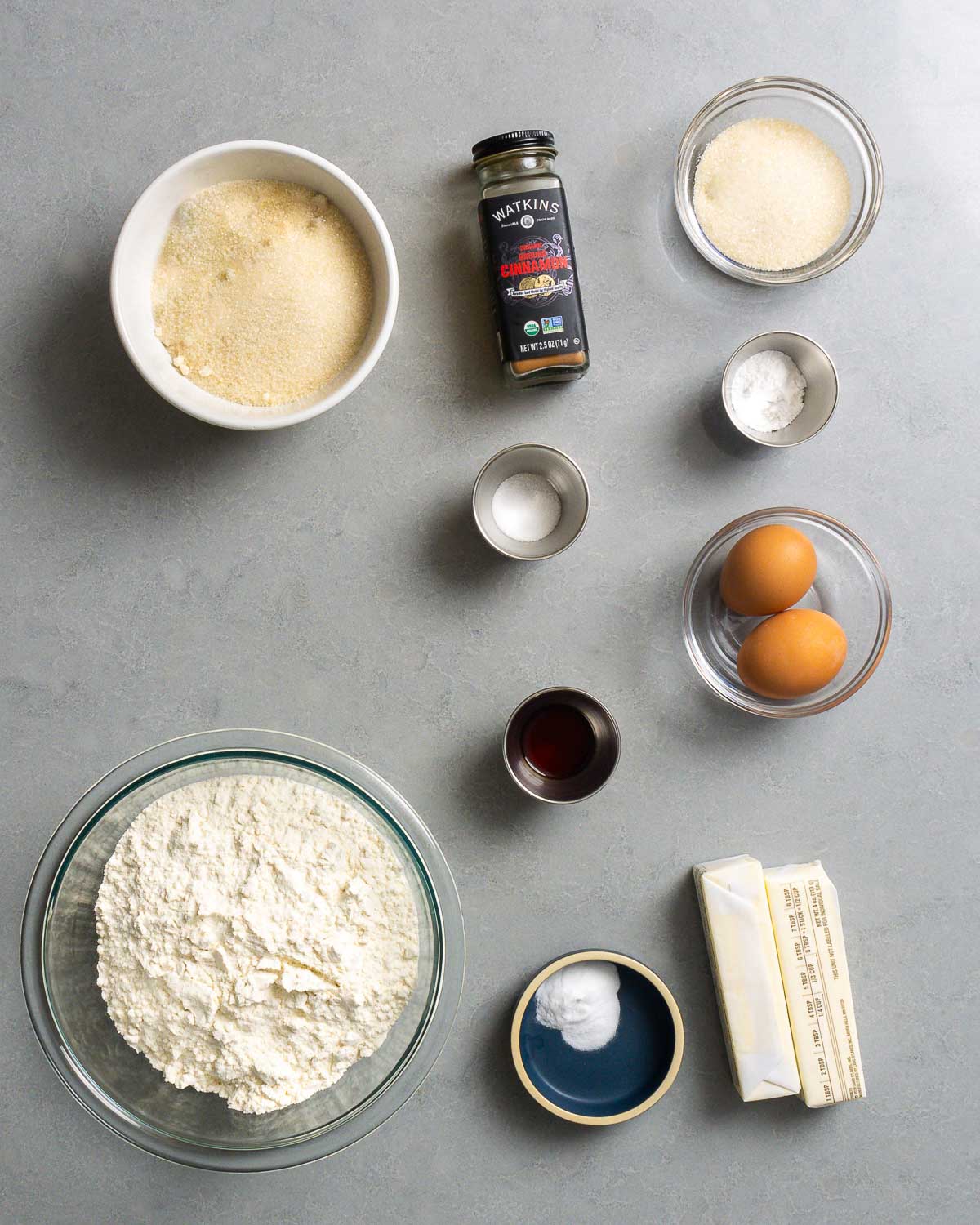 Ingredients shown: sugar, cinnamon, salt, cream of tartar, vanilla extract, eggs, flour, baking soda, and butter.