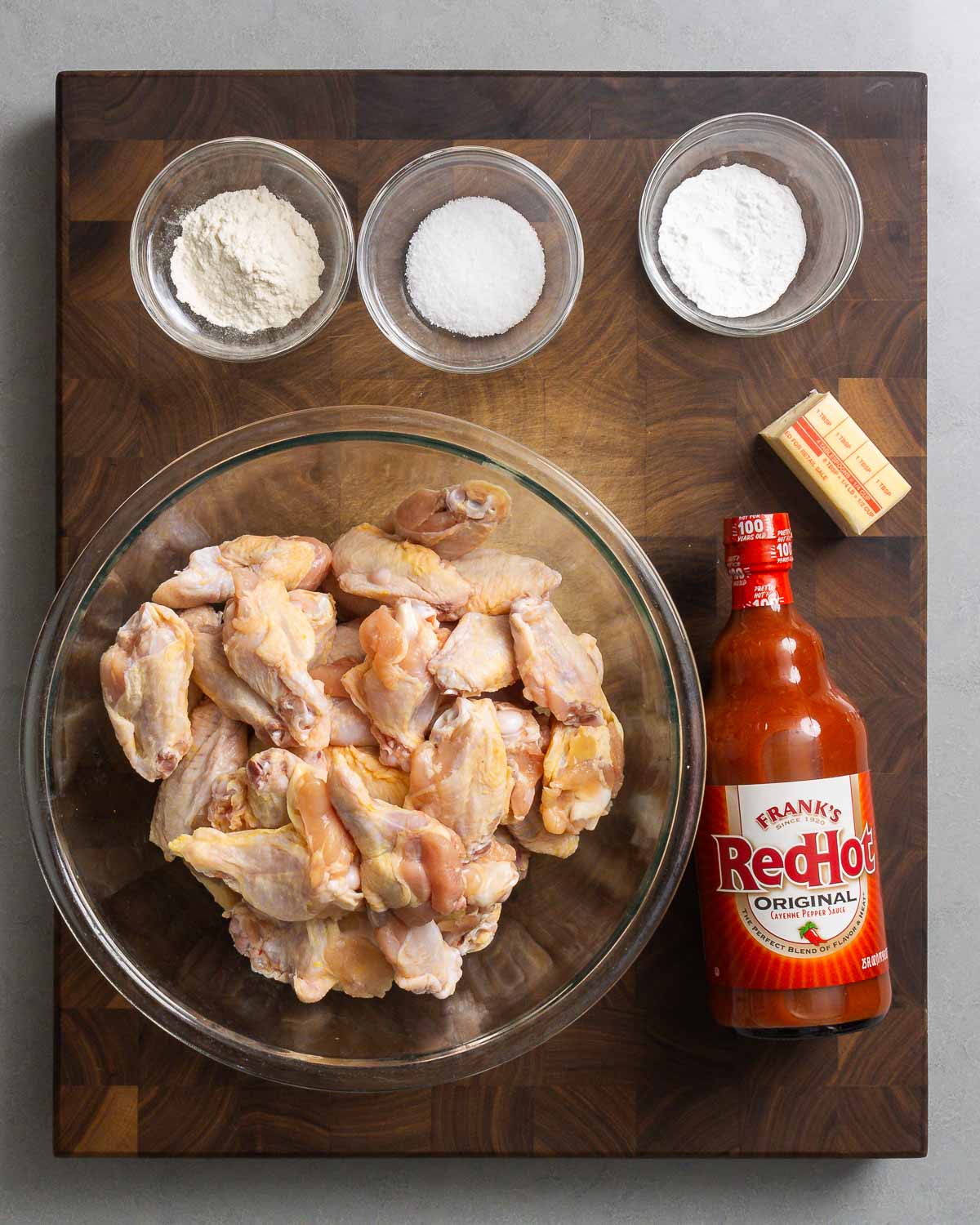 Ingredients shown: flour, Diamond crystal kosher salt, baking powder, butter, party wings, and Frank's red hot sauce.