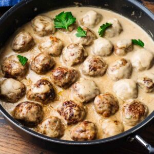 Swedish meatballs in black pan for featured image.