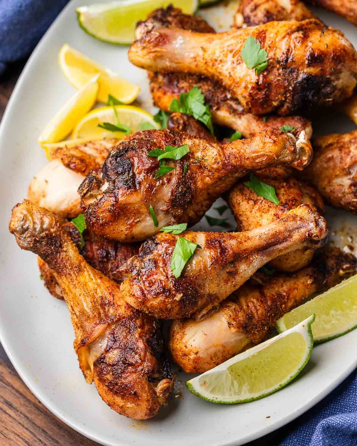 Platter with baked chicken legs.