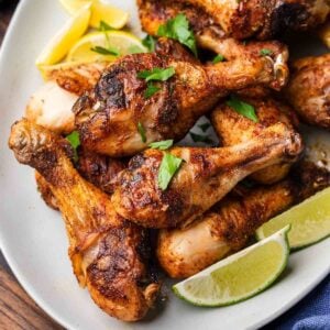 Platter of Baked Cajun chicken legs for featured image.