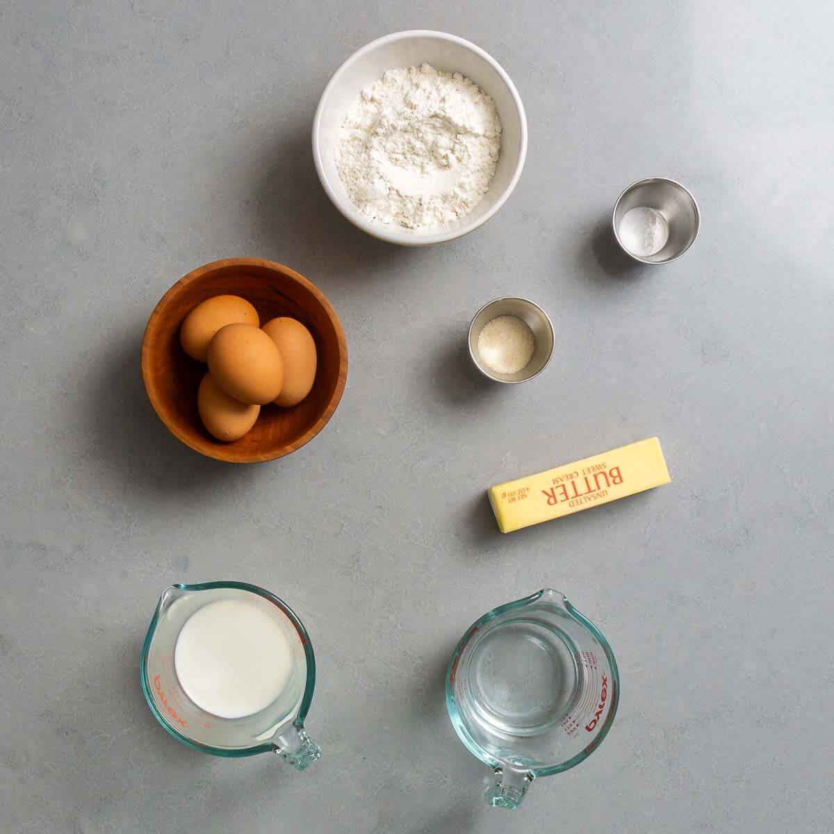 Choux pastry Ingredients shown: flour, salt, sugar, eggs, butter, milk, and water.