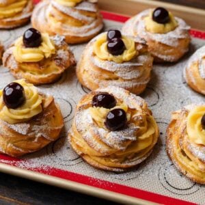 St. Josheph's Day Pastries on silicon lined baking sheet for featured image.