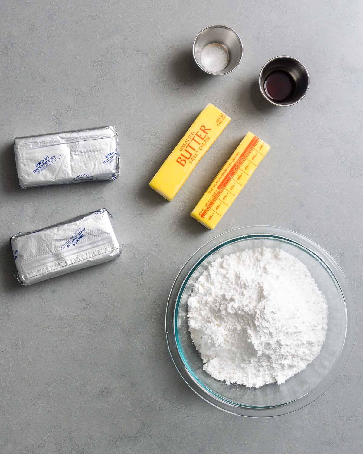 Ingredients shown: salt, vanilla, cream cheese, butter, and powdered sugar.