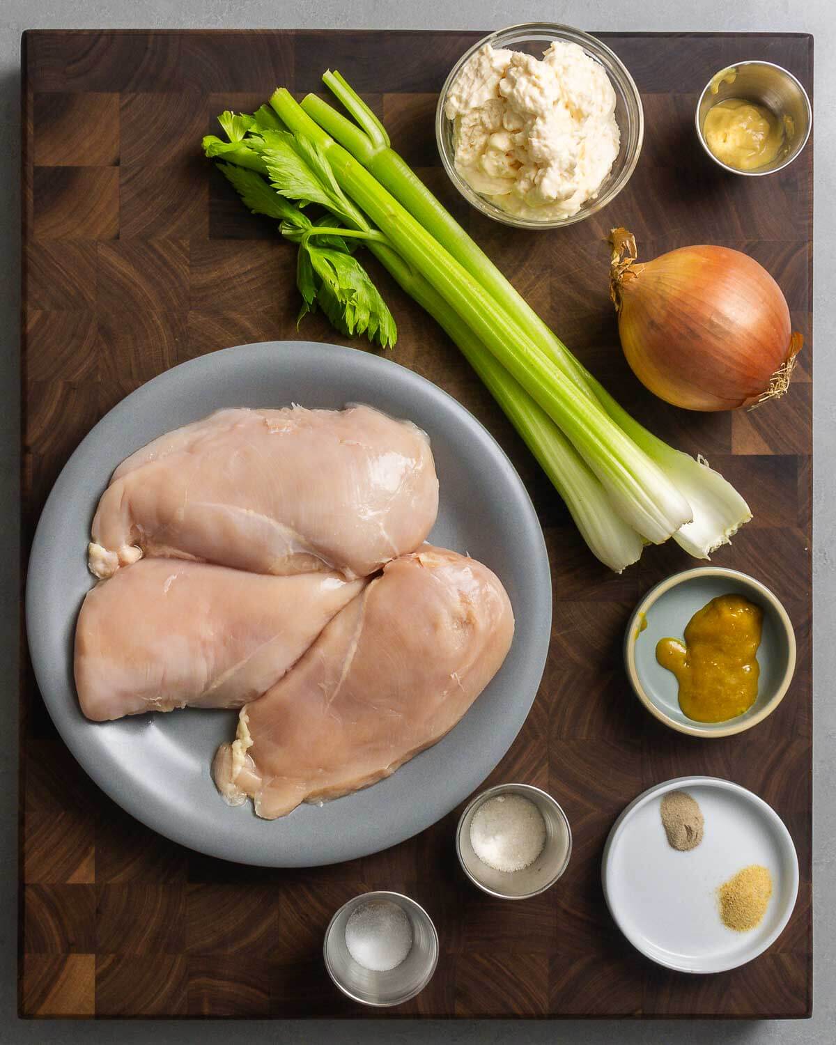 Ingredients shown: chicken breasts, celery, mayonnaise, Dijon mustard, onion, salt, sugar, pepper, garlic powder, and chicken base.