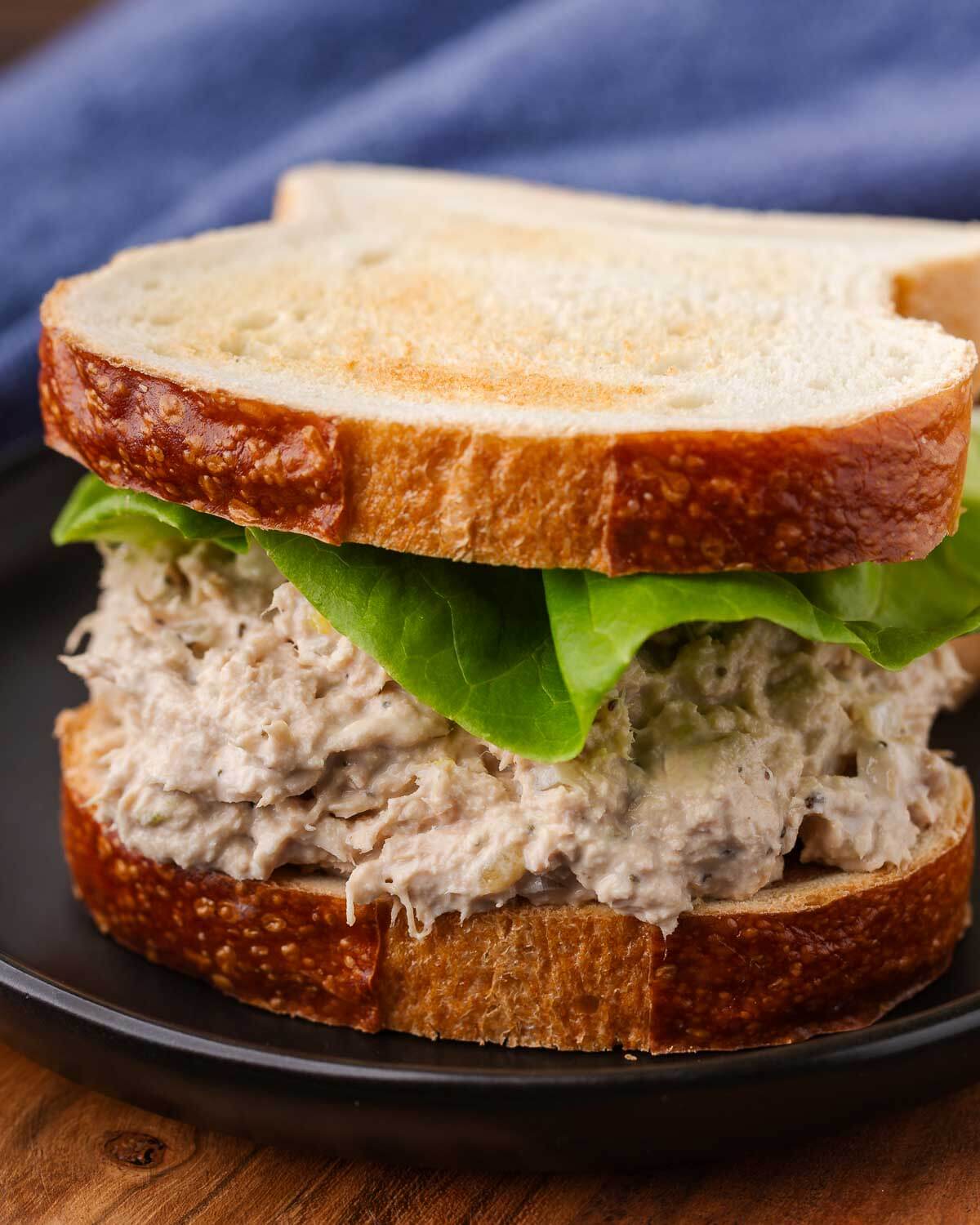 New York deli tuna salad on white toast with lettuce.