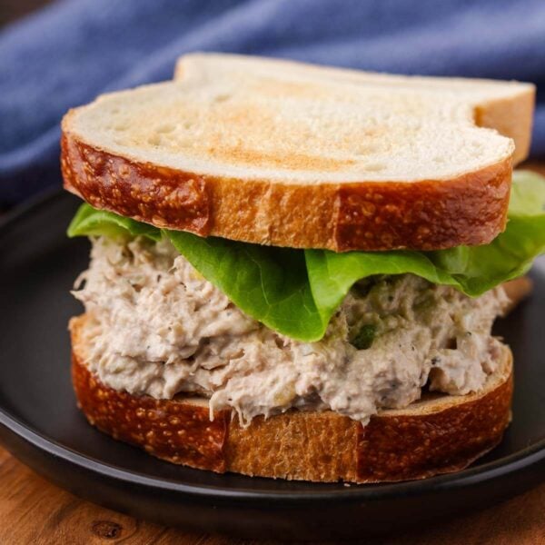 Deli tuna salad on white toast for featured image.