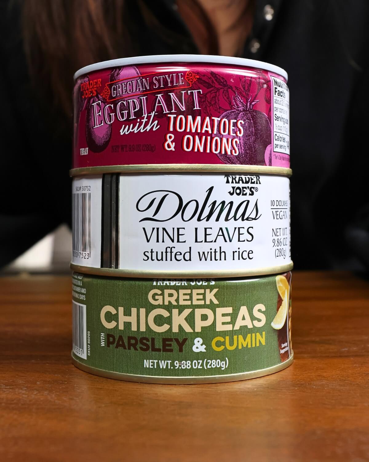 Picture of Trader Joe's canned Greek eggplant with tomatoes, stuffed grape leaves, and Greek chickpeas with cumin.
