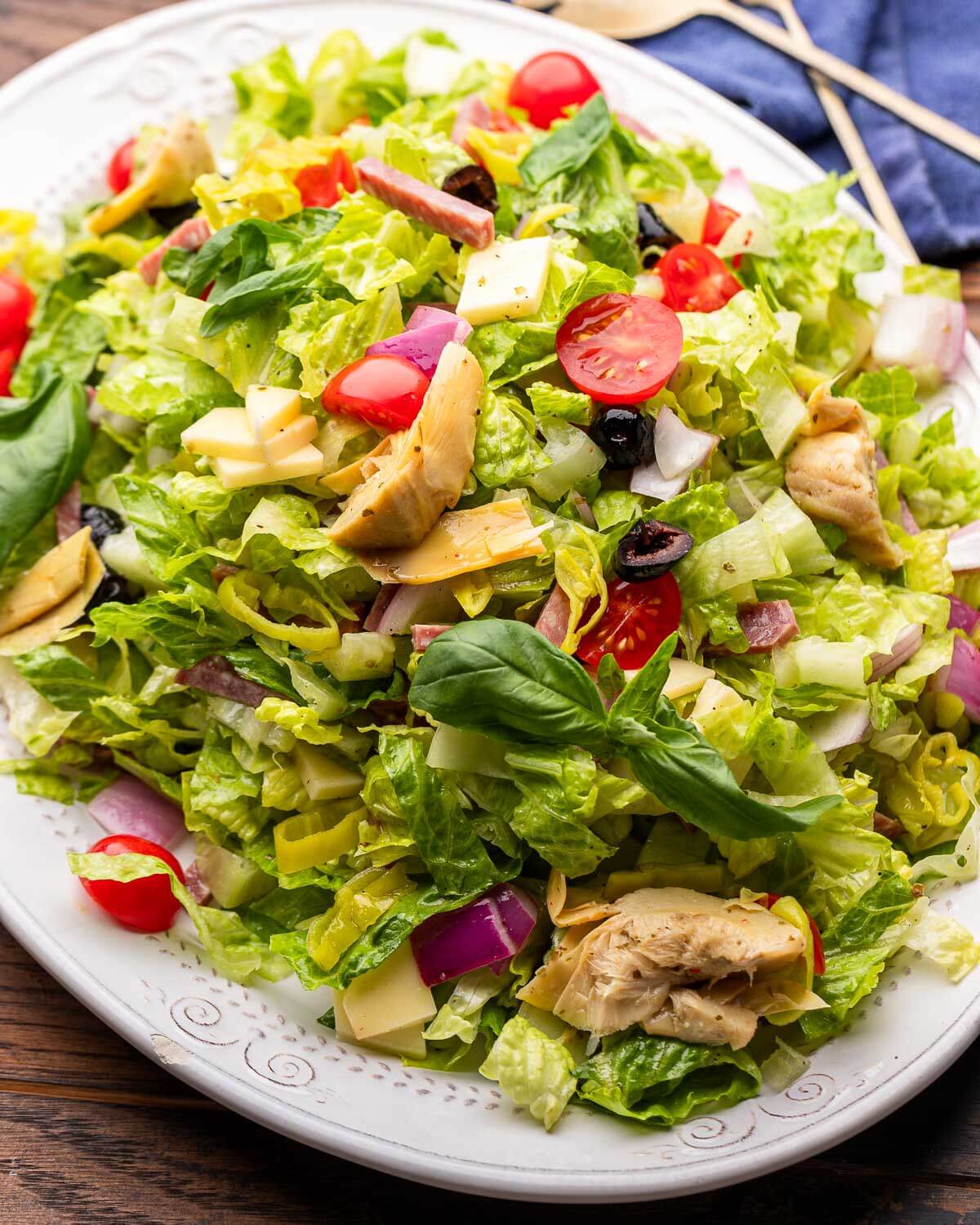 White platter filled with a large Italian chopped salad.