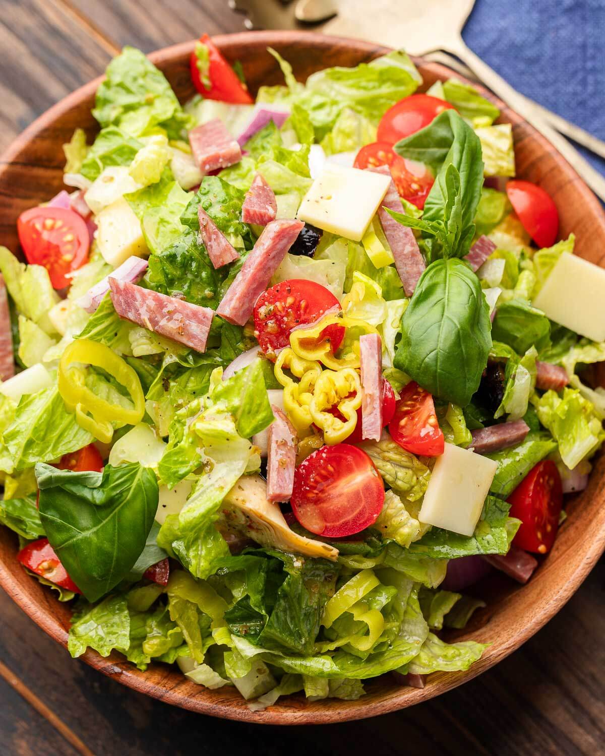 Chopped Italian-style salad in wood bowl.