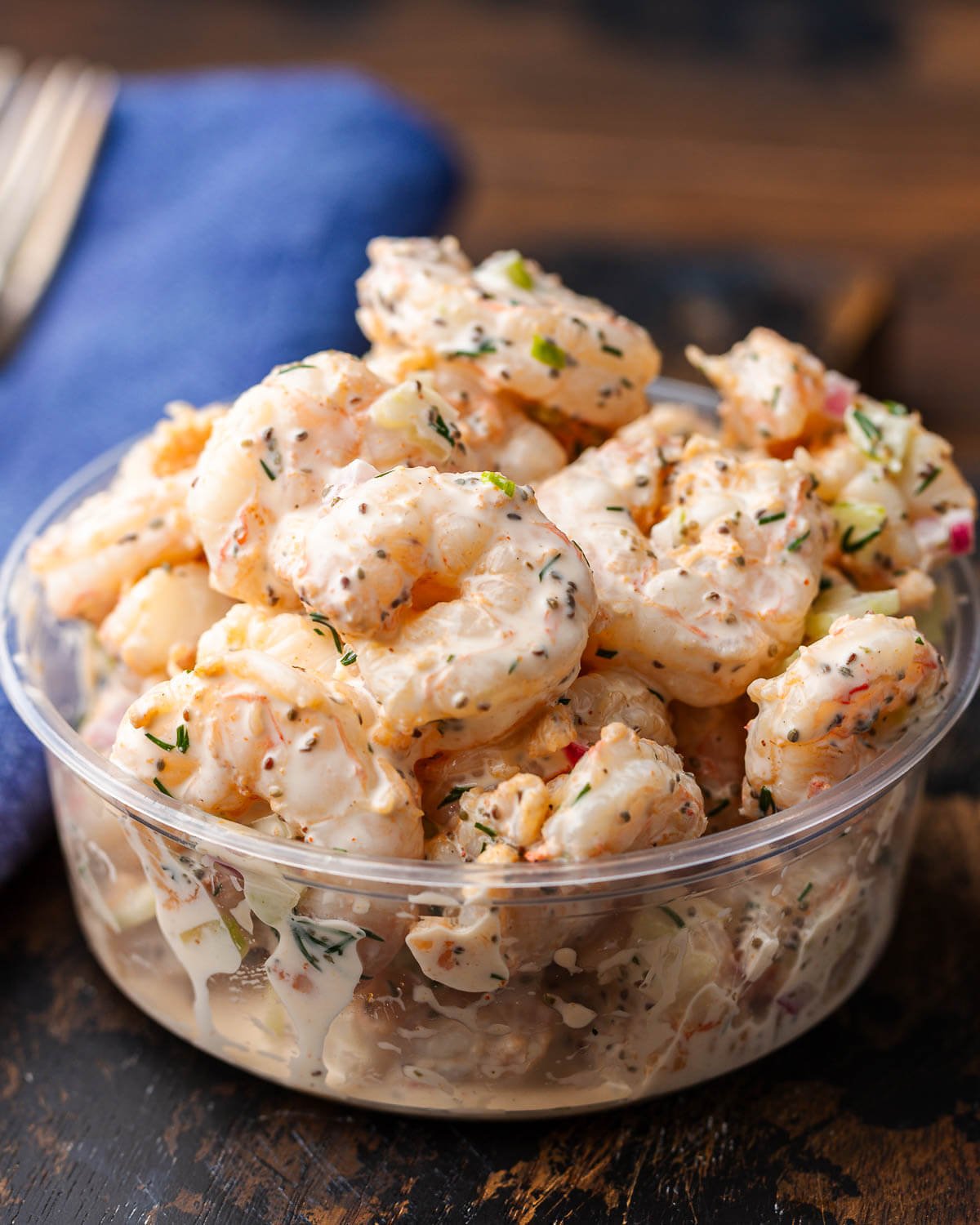 Shrimp salad in deli container.