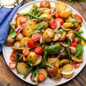 Italian potato green bean salad on white platter.