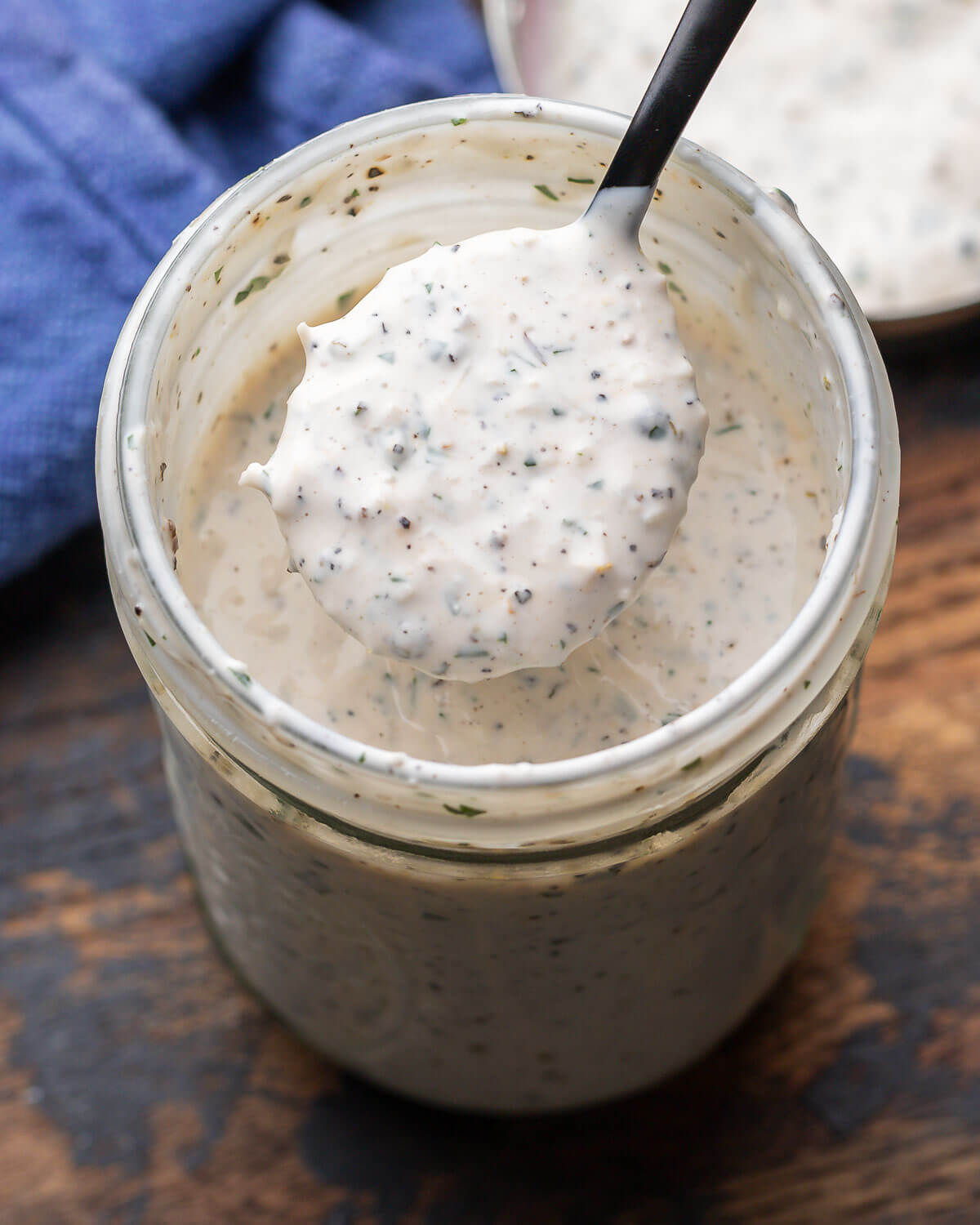 Creamy parmesan peppercorn dressing in mason jar.