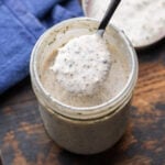 Creamy parmesan peppercorn dressing in mason jar.