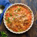 Italian zucchini casserole in baking dish on table.