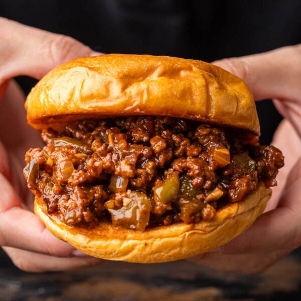 Sloppy Joe sandwich held in hands.