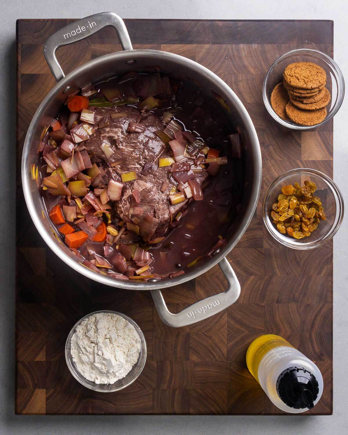 Ingredients shown: rump roast marinating in pot, ginger snap cookies, golden raisins, flour, and olive oil.